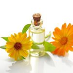 Yellow and orange flowers with essential oil