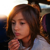 Young girl deep in thought